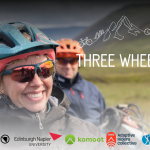 The photo shows a woman and a man sitting on handcycles in the Scottish Highlands. The film title Three Wheel Drive is shown, along with the sponsor logos